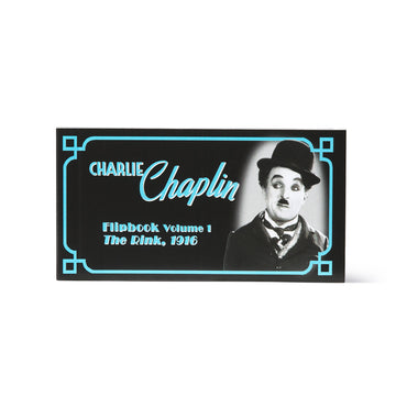 Cover of Charlie Chaplin flipbook with black and white image of Chaplin and text on a white background. Flip book at the Academy Museum Store Los Angeles